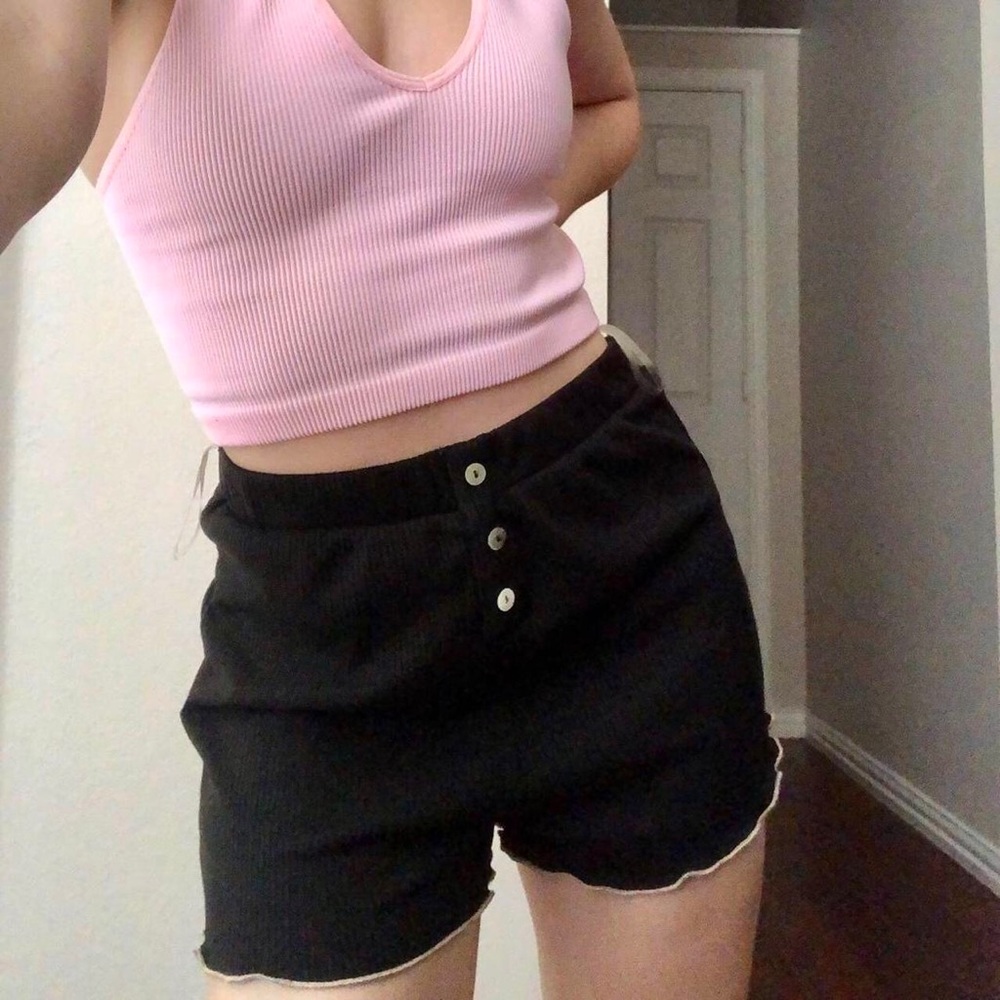 Black lettuce trim shorts with button details